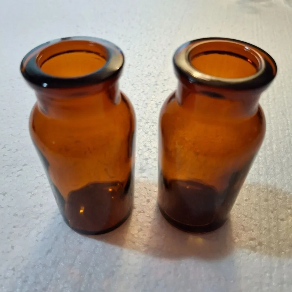 2 W Encircled Amber Glass Bottles 3 3/8